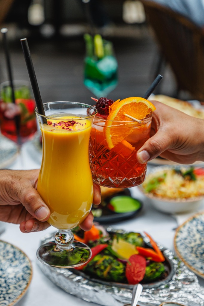 Cheers with Mango Lassi and cocktail